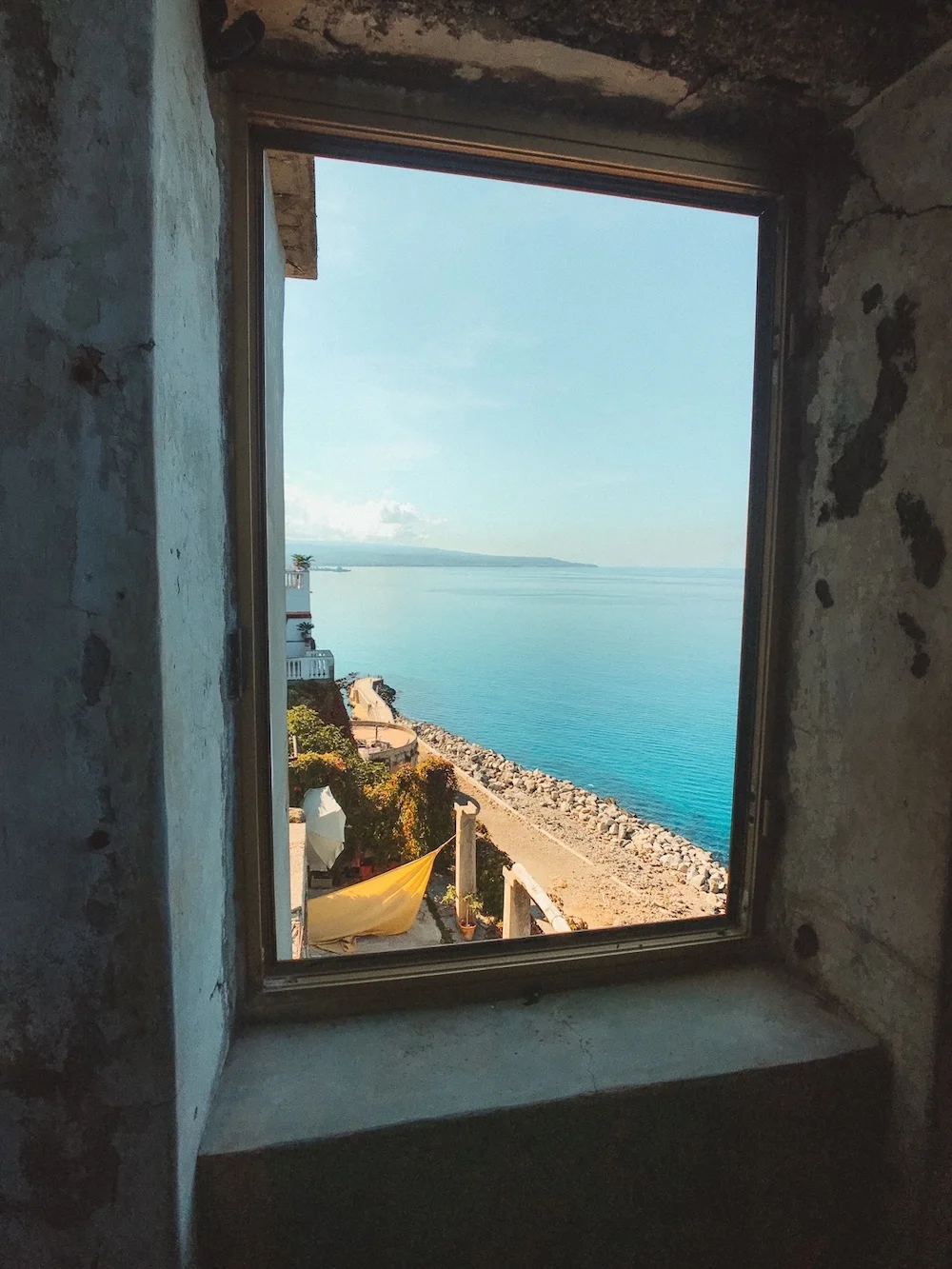 Ocean coast view through a concrete window frame
